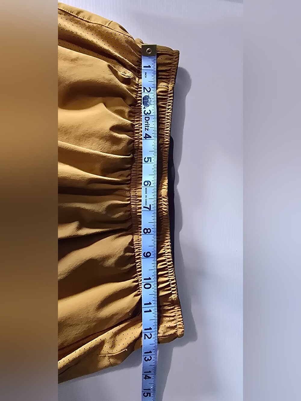 Saucony Outpace 5" running shorts In "Bronze" - Picture 8 of 11